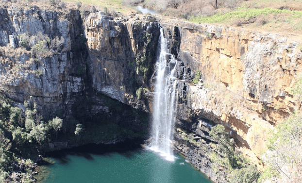 Scenic waterfall cascading into a deep pool on the Panorama Route.
