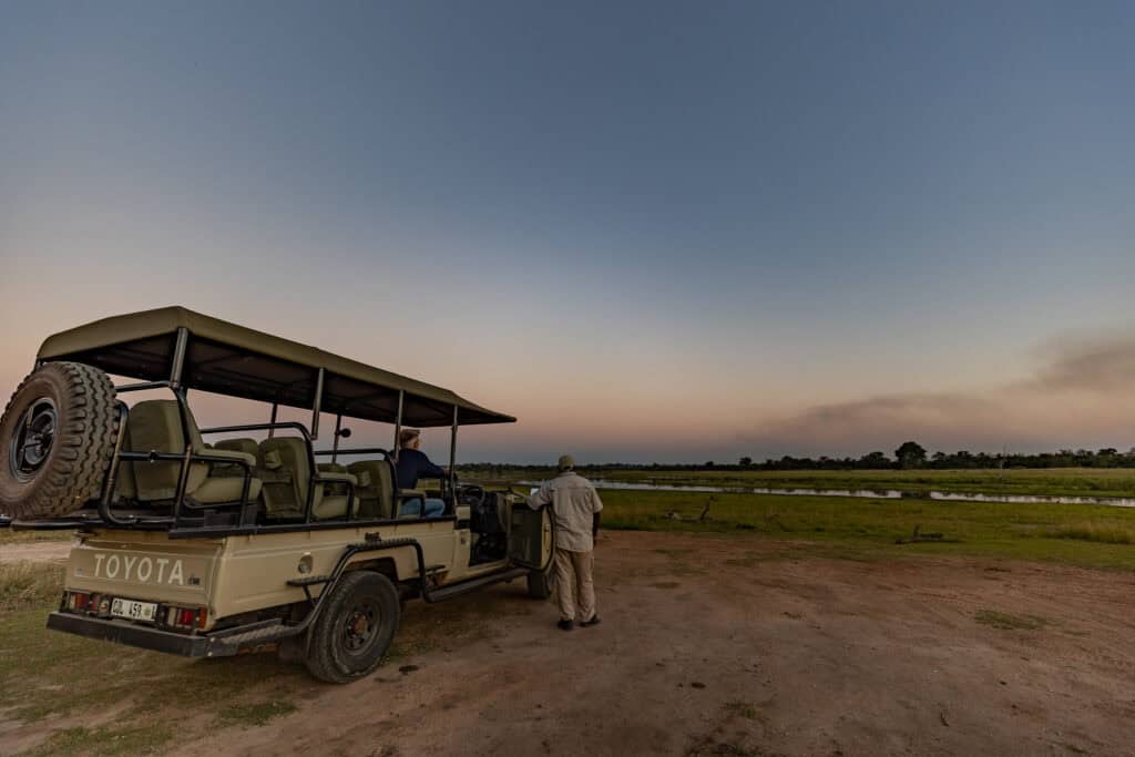Safari vehicle at Ndzhaka Tented Camp during sunset.