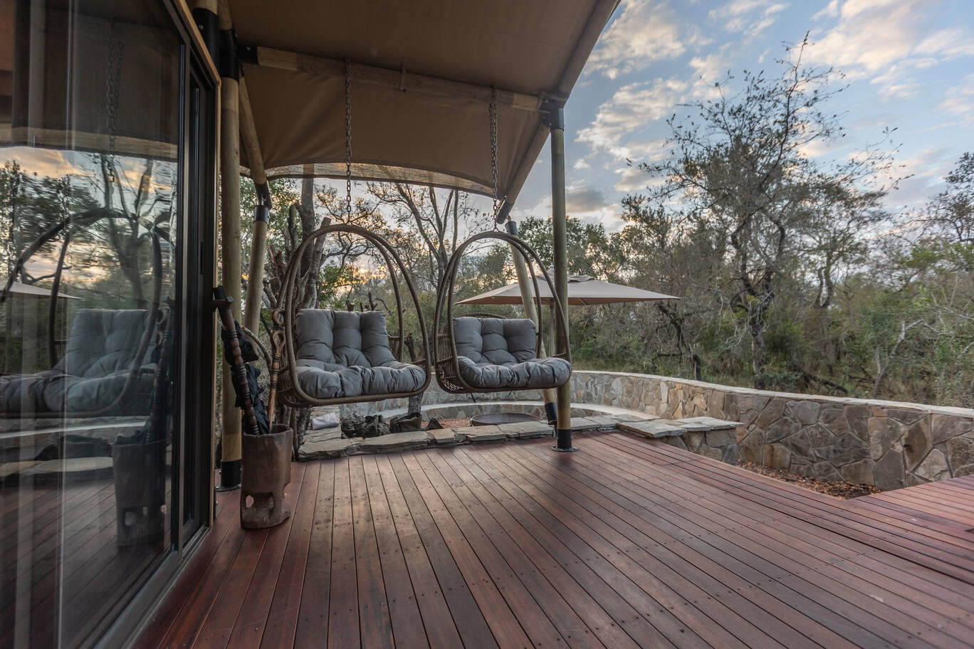 Relaxing outdoor deck with swings at a safari lodge in Africa.
